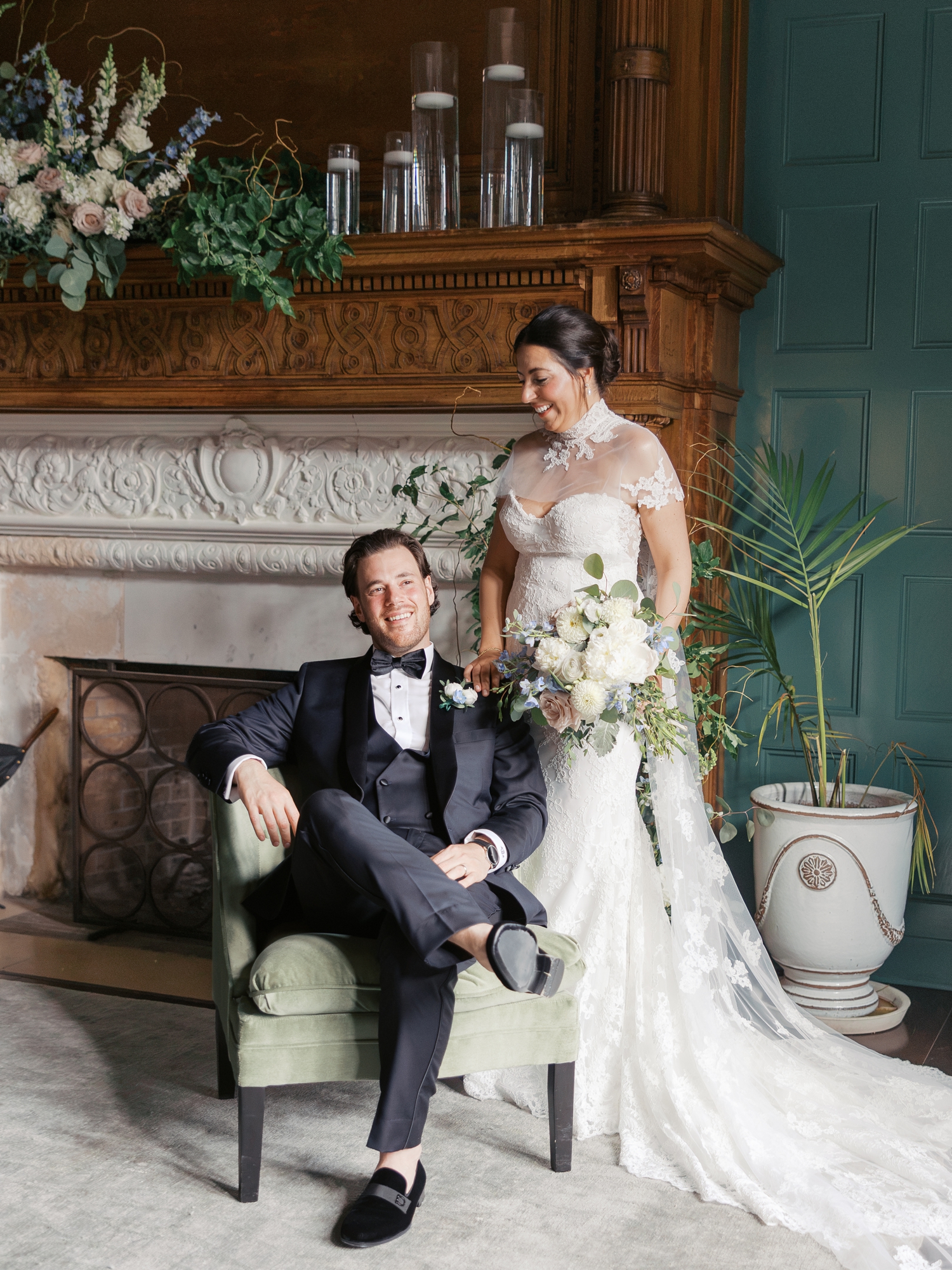 Bride and groom photographed beside the fireplace inside Pendry Natirar