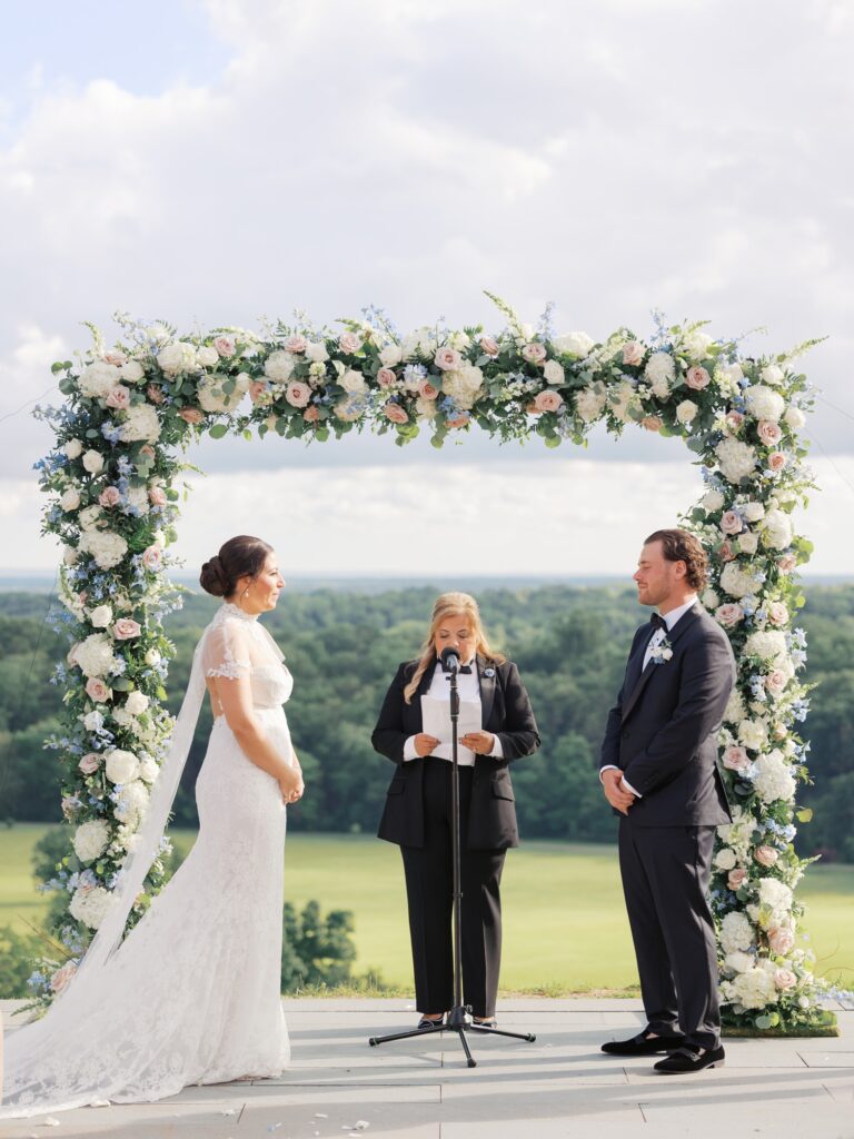 Outdoor summer wedding ceremony overlooking Natirar Park