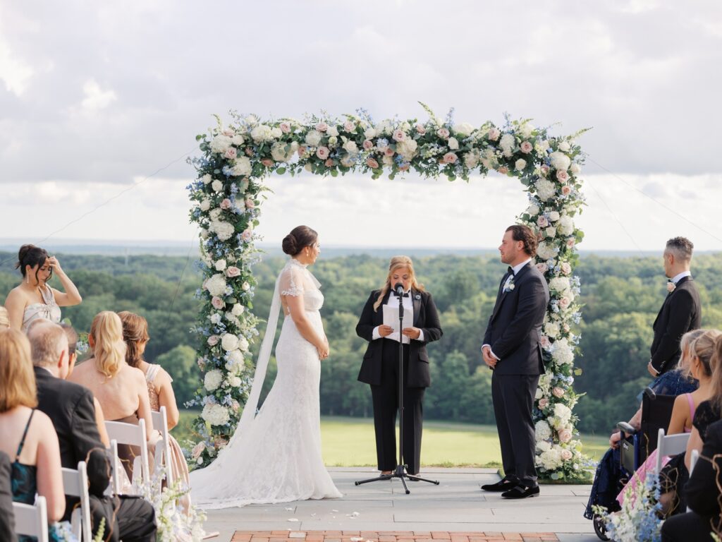 Outdoor summer wedding ceremony overlooking Natirar Park