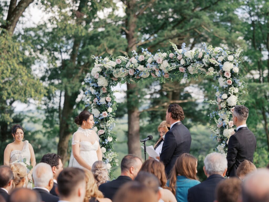 Outdoor summer wedding ceremony overlooking Natirar Park