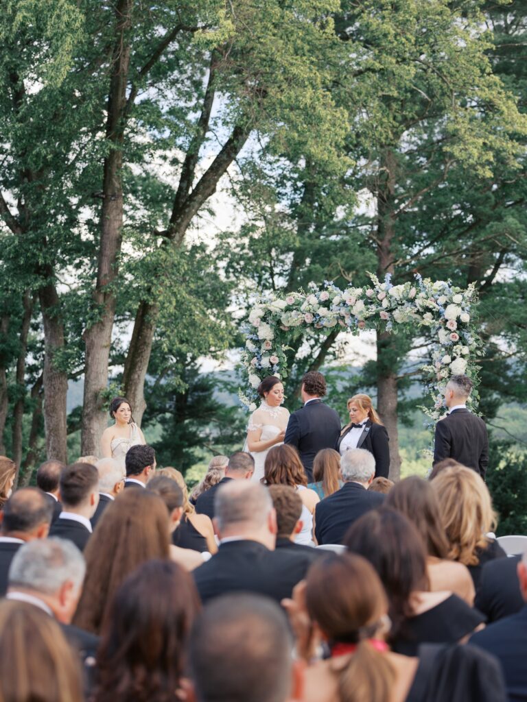 Outdoor summer wedding ceremony overlooking Natirar Park