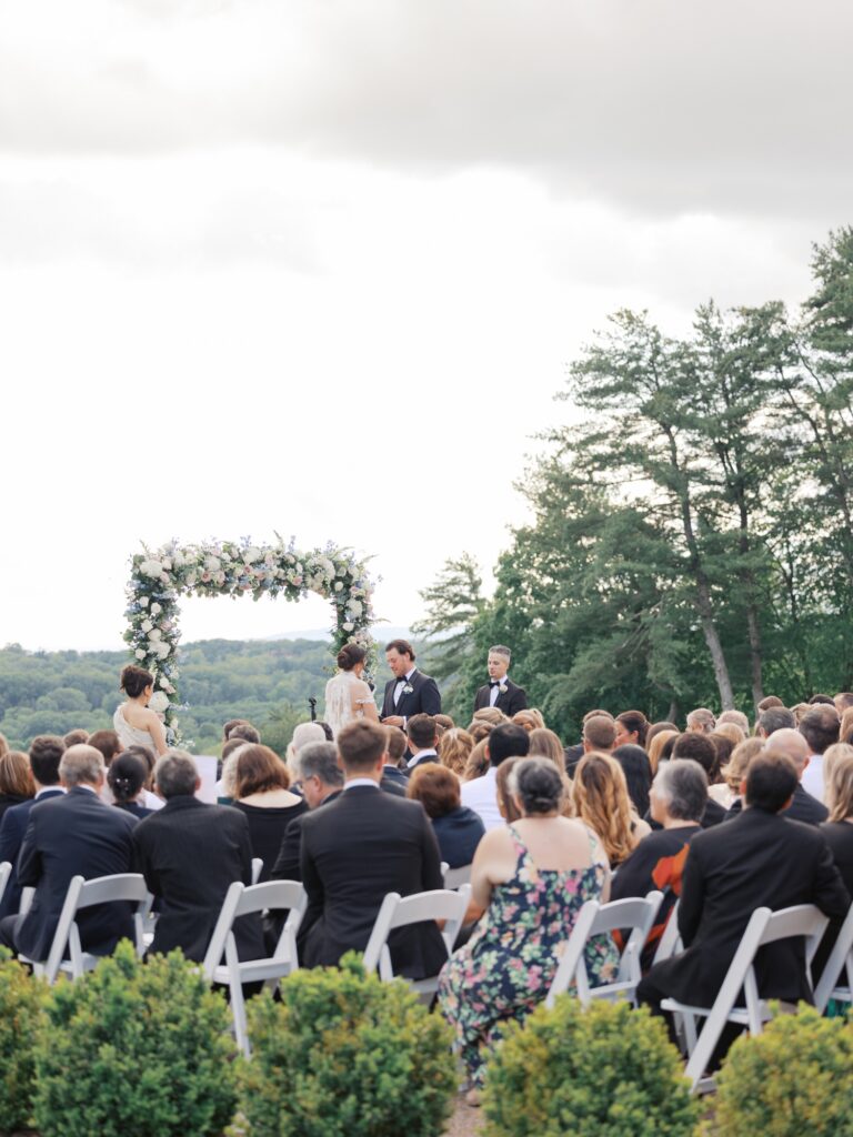 Outdoor summer wedding ceremony overlooking Natirar Park