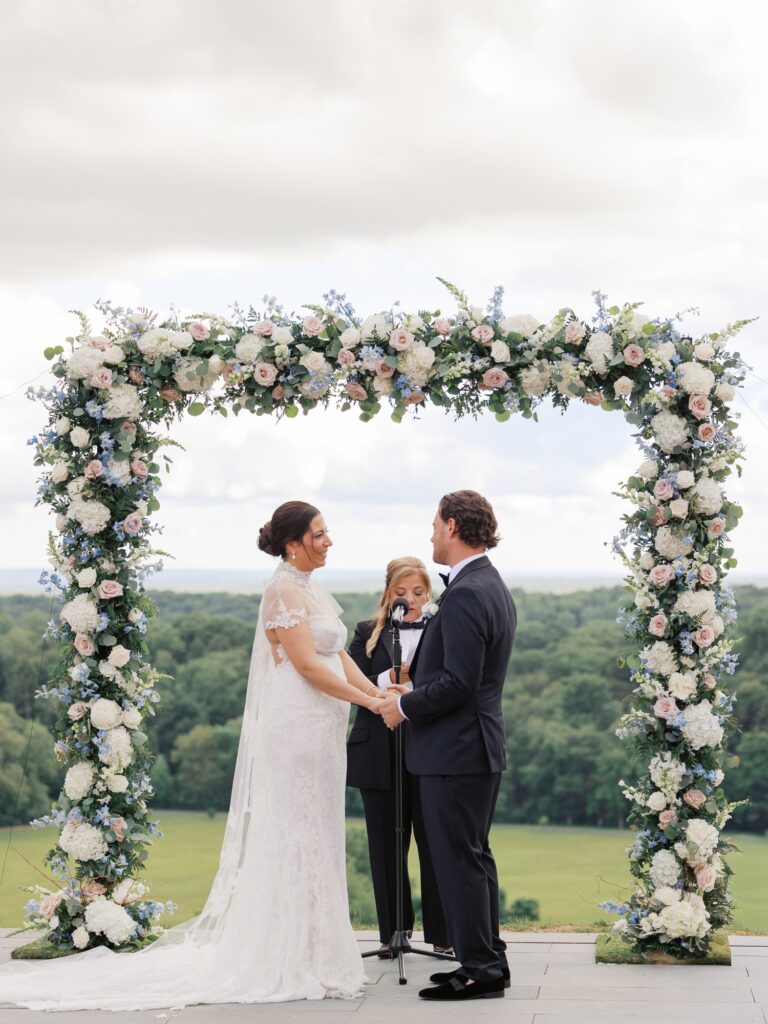 Outdoor summer wedding ceremony overlooking Natirar Park